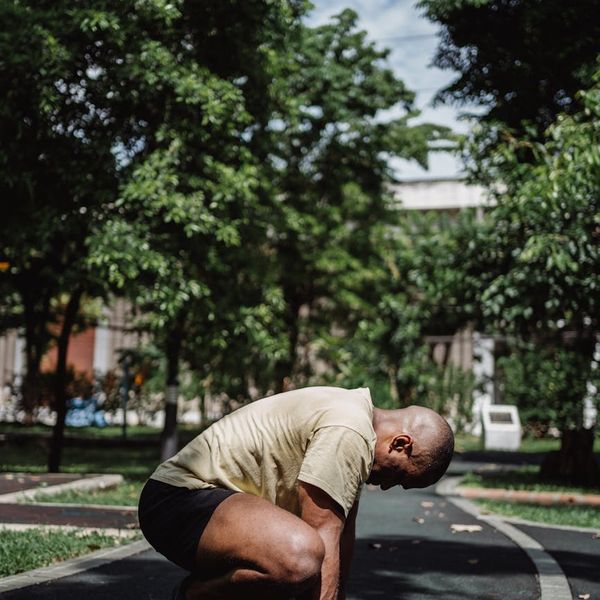 Dynamic motion blur of a man performing a squat