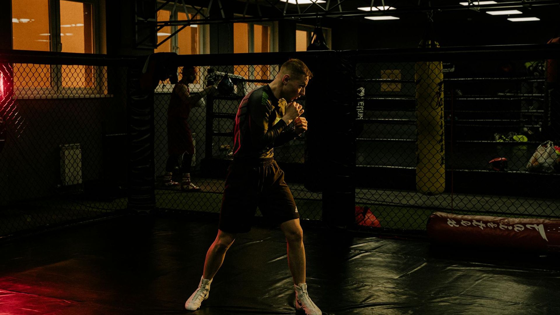 Man focusing before a strength training session in a dark gym